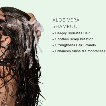 Person washing hair with aloe vera shampoo on a light green background