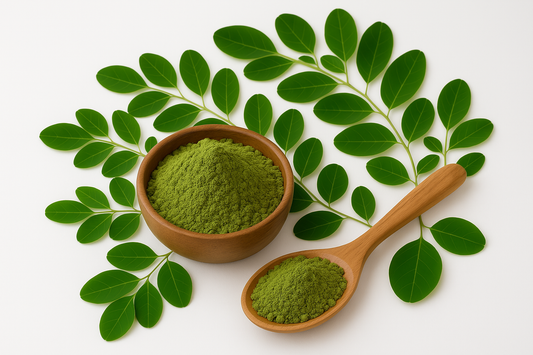 Fresh Moringa leaves and Moringa powder in a wooden bowl - natural Ayurvedic superfood for immunity and energy
