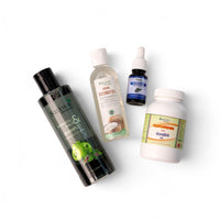 Set of natural health and wellness products including shampoo, coconut oil, and tablet on a white background
