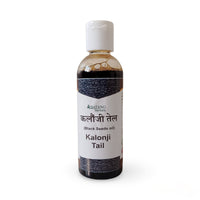 Bottle of Kalonji Tail oil with a white label on a white background